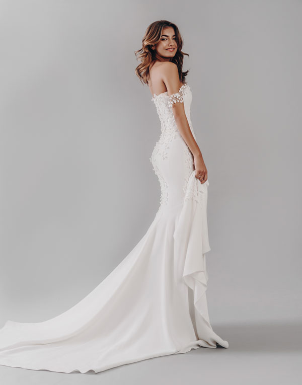 Monroe is one of our show stoppers. With it's incredible silhouette and its soft crepe fabric, what's not to love?!  The pretty petal neckline detail adds a real softness and feminity to the straight across design and the train adds drama to an already memorable dress!