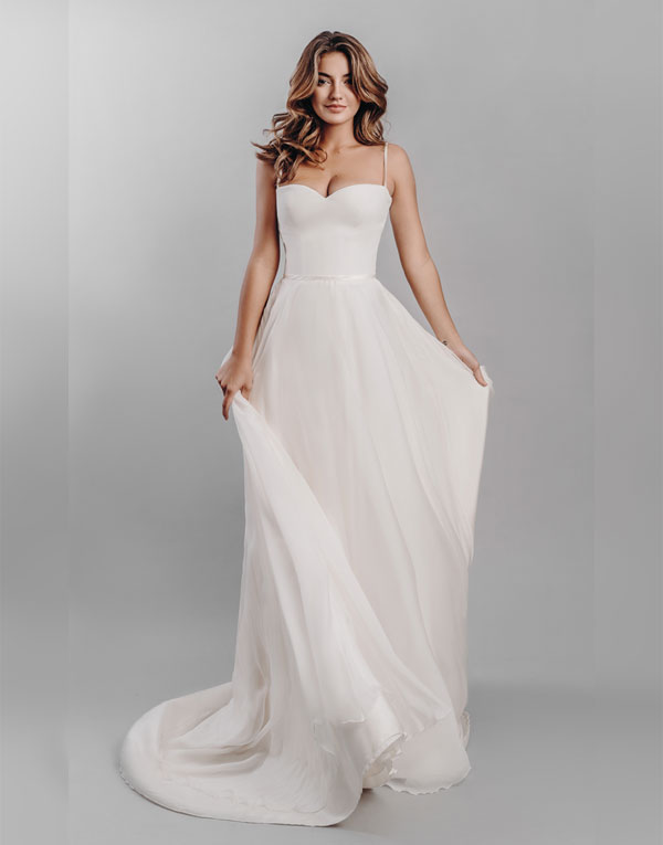 Liberty. A simply stunning understated dress.  Liberty has a plunging sweetheart crepe bodice and a full circle chiffon skirt and is subtly finished with a hint of satin around the waist and strap detail.  A perfectly elegant and classic wedding dress silhouette.